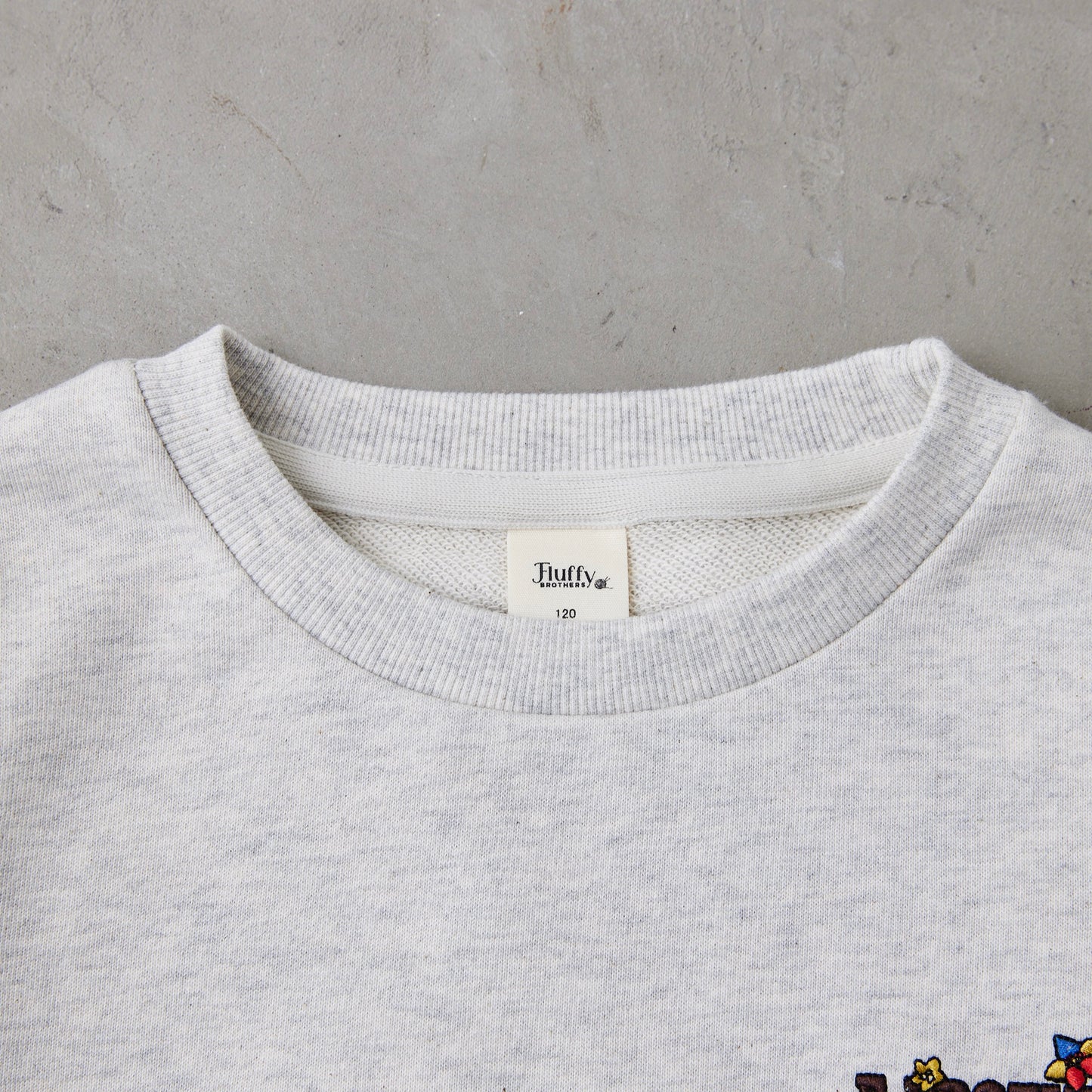 花ロゴ刺繍トレーナー